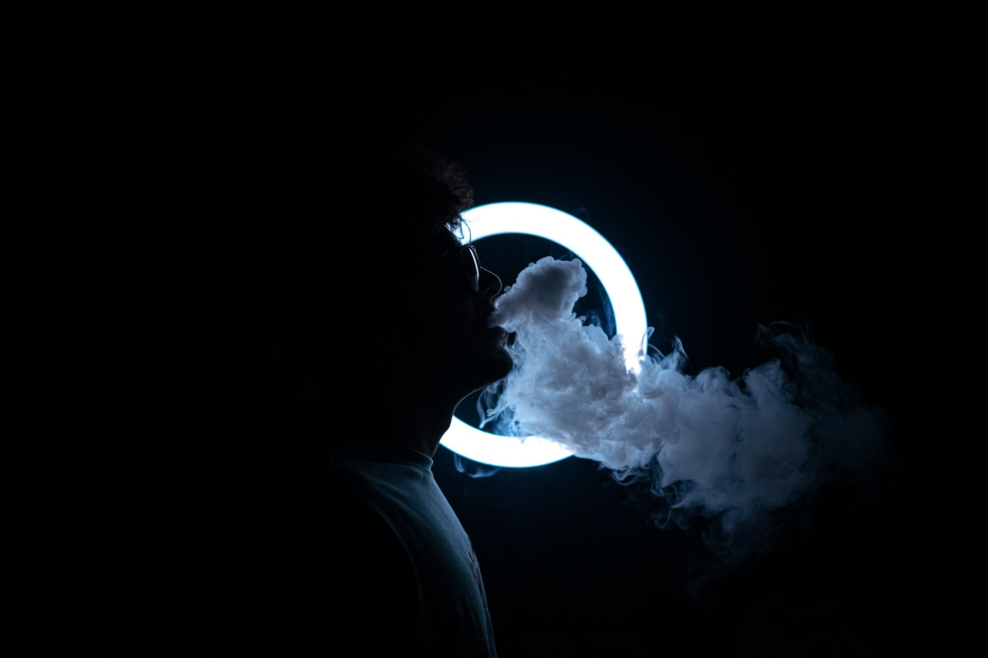 a person holding a light bulb